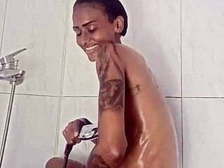 Amateur ebony babe enjoys a shower solo