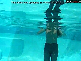 Hungarian beauty Diana Kalgotkina enjoys a solo swim in the pool