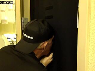 Gay men engage in oral and manual stimulation at a gloryhole